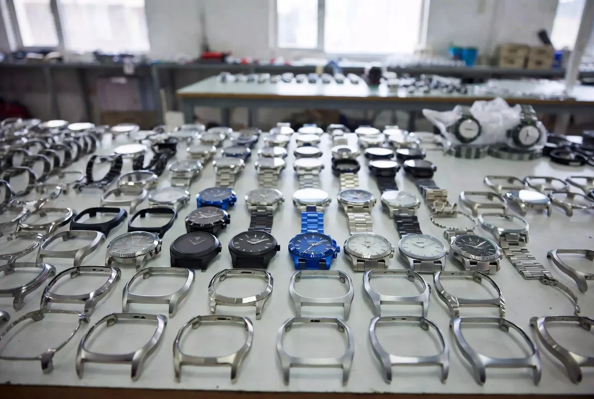 ODM watch manufacturer design library showing base platforms customized for different brands Professional showroom display of multiple ODM watch case and dial variations with brand logo and colorway customizations ready for client selection